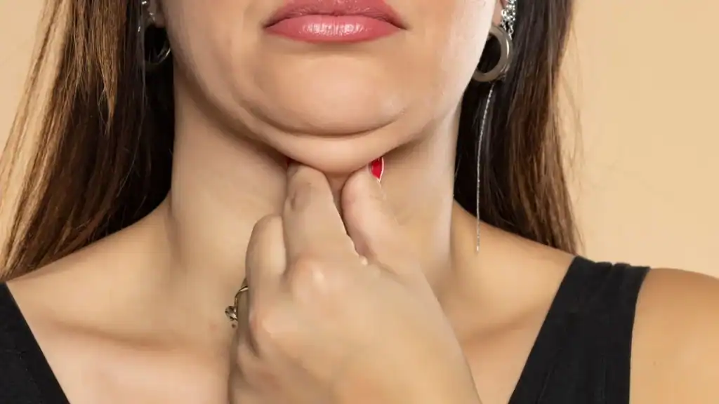 An image of a woman with double chin, sad, worried : Non Surgical Double Chin Removal Treatment in Stony Stratford, UK